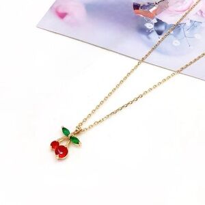 Gold Cherry Pendant Necklace with Red and Green Accents